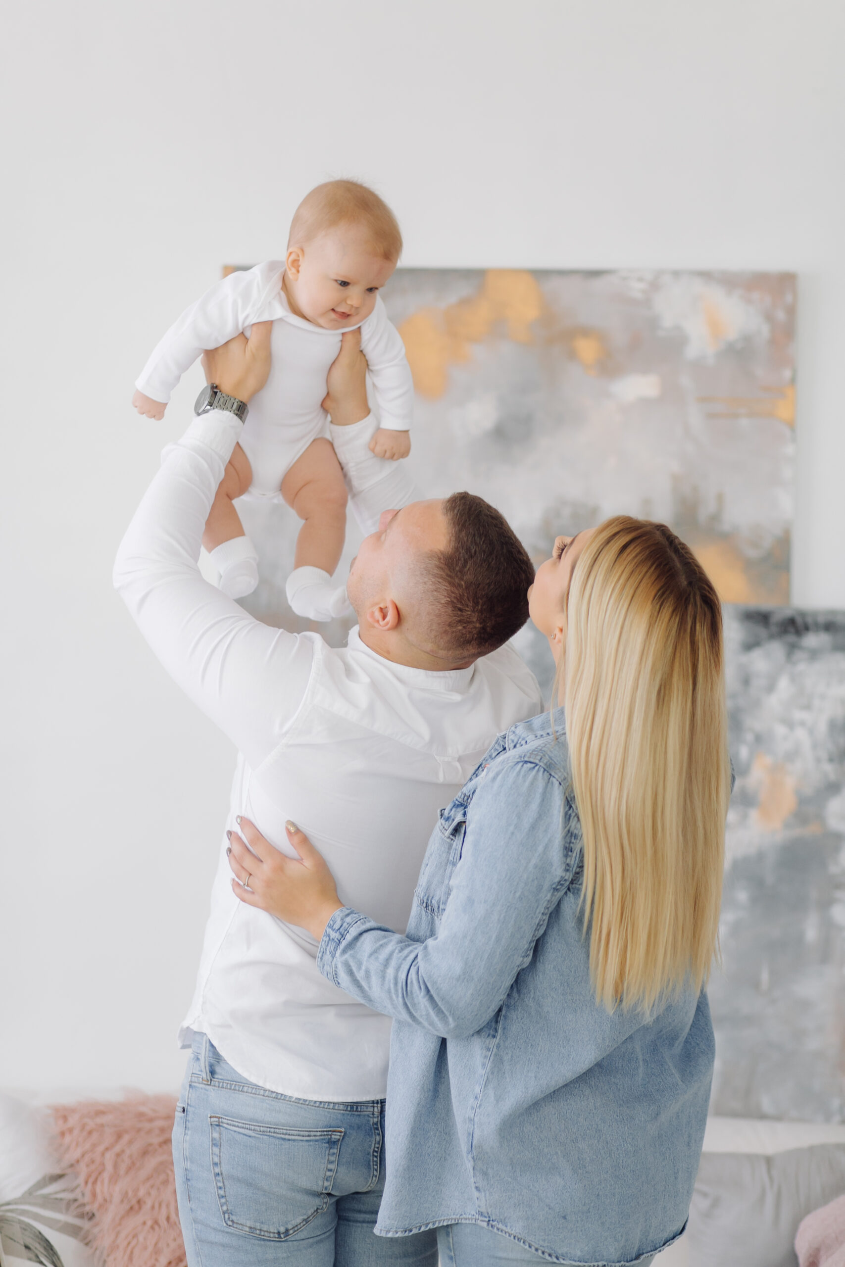 Portrait of a young family in the studio
